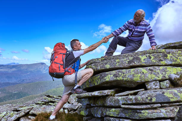 istock Help, support and help in a dangerous situation to hike in the mountains. 866802402