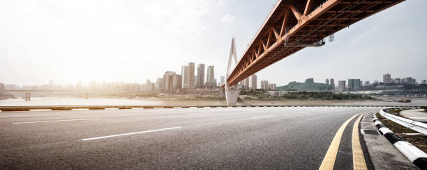 istock empty asphalt road with modern bridge and buildings 866802666