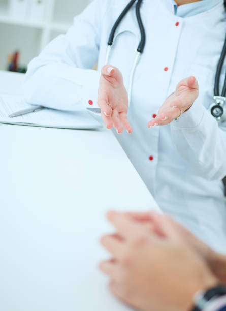 istock Doctor and patient are discussing something, just hands at the table. 866803308