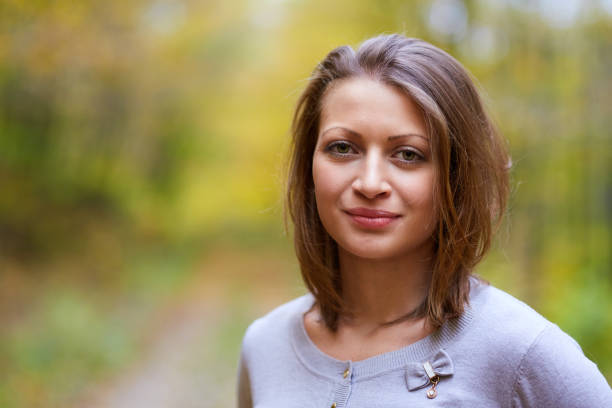 Closeup of a beautiful blond female model in the autumn
