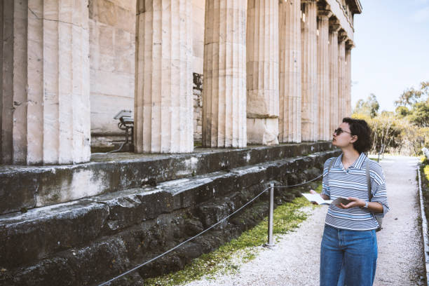 istock Young woman visiting Ancient Agora of Athens 866809902