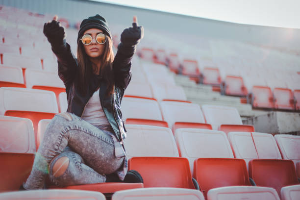 istock Hipster woman cheering at the stadium 866819268