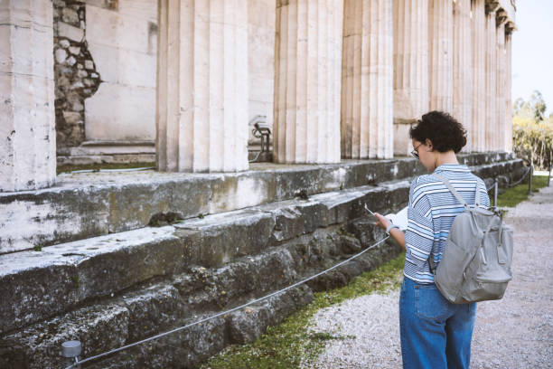 istock Young woman visiting Ancient Agora of Athens 866822890