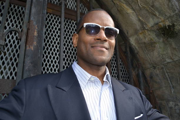 istock Model smiling wearing a business suit and shades 866825516