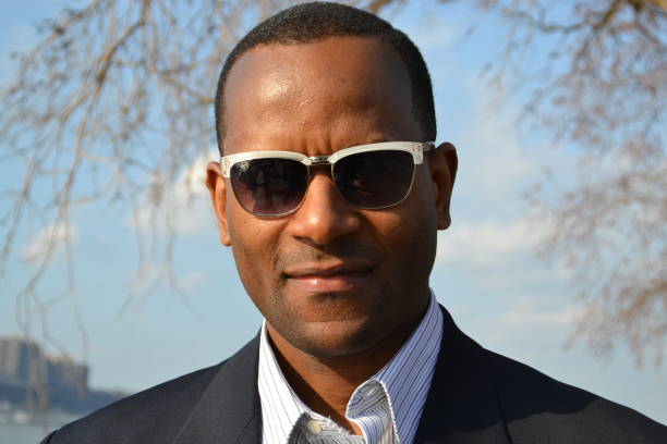 istock Model singing, wearing a collared dress shirt and shades 866825900