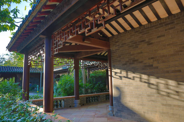 istock Chinese style corridor in a garden 866826304