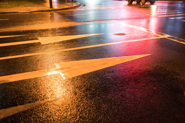 istock rain night in the street with asphalt road 866833396