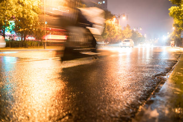 istock rain night in the street with asphalt road 866833798
