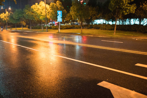 istock rain night in the street with asphalt road 866836744