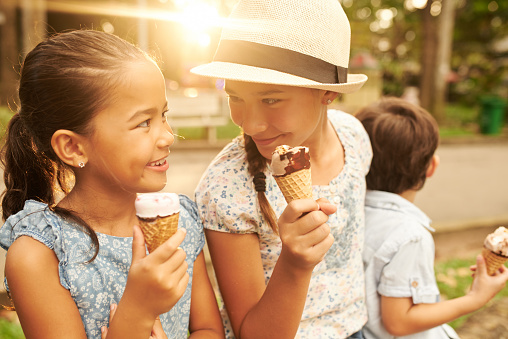 Littler friends enjoying ice-cream on sunny day