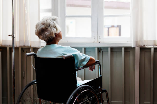 istock Old woman on a wheel chair 866842082