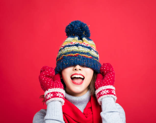 Happy Young Beautiful Woman in winter clothes Happy Young Beautiful Woman in winter clothes warm clothing stock pictures, royalty-free photos & images