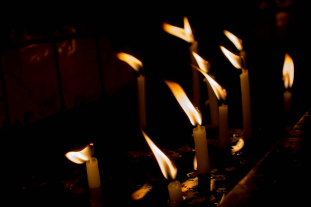 istock Burning candles give light in the dark 866846704