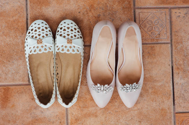 istock Shoes and legs of the bride on the floor 866856464