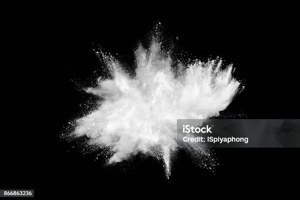 Freeze Motion Of White Powder Explosions Isolated On Black Background Stock Photo - Download Image Now