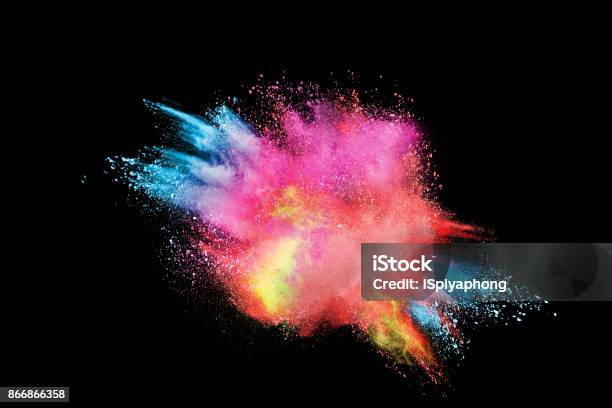 Freeze Motion Of Colored Powder Explosions Isolated On Black Background Stock Photo - Download Image Now