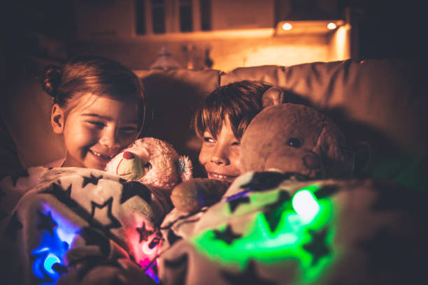 istock Brother and sister sleeping at home 866876554