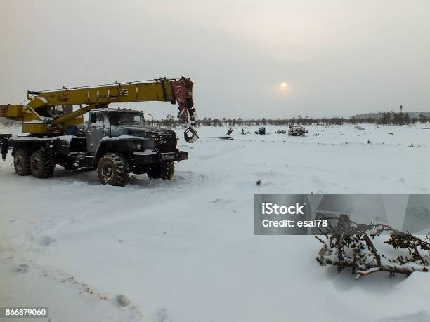 The Truck Crane In The Snow In The Field Stock Photo - Download Image Now - Agricultural Field, Autoclave, December