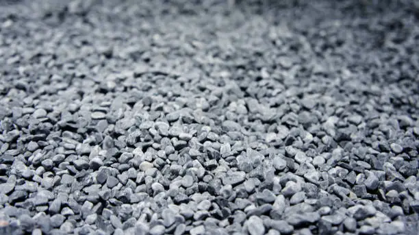 Photo of Coarse gravel, black and gray. Background texture