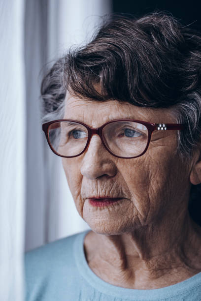 istock Lonely elderly woman with glasses 866882656