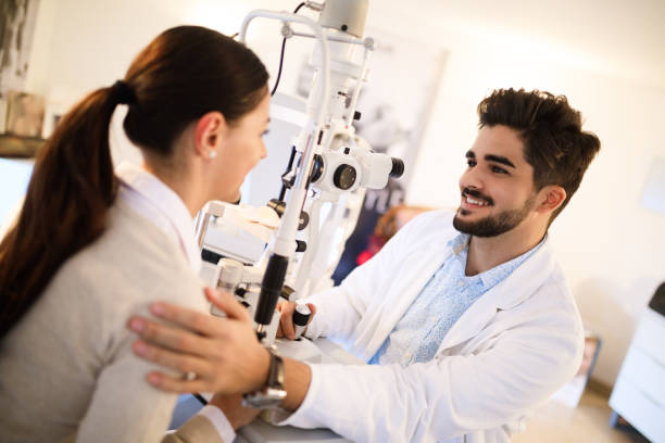 istock Young woman having her eyes examined by optometrist. 866882798