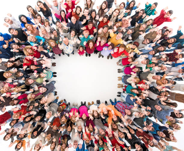 istock High angle view of crowd of people in a circle. 866883162