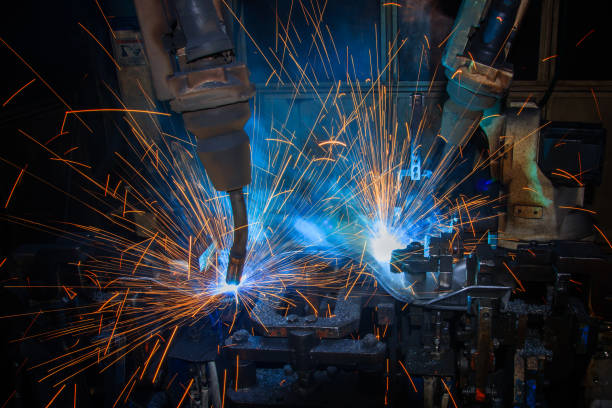 istock robot welding part in automotive industrial 866887538