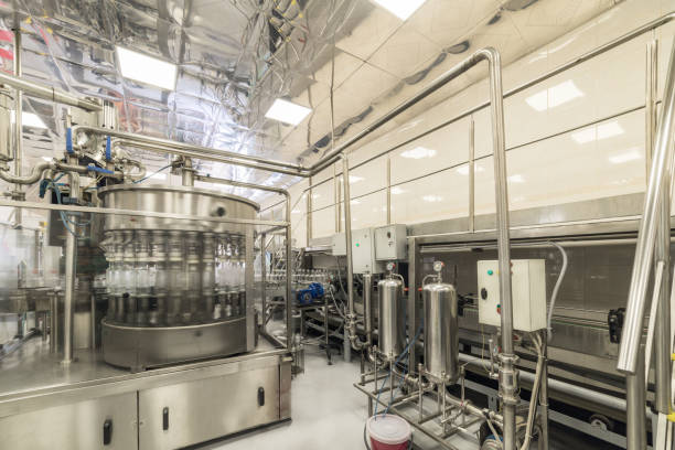 istock The shop for bottling beverages. Automatic filling line 866890056