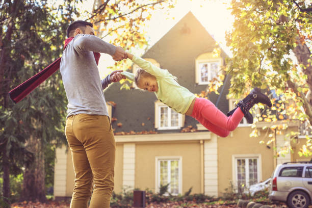 istock Happy family outside in colorful fall backyard. 866894974