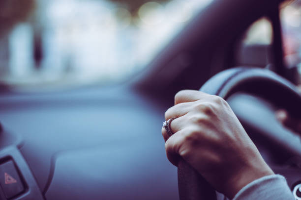 istock Close-up of a woman's hand holding a car handle 866894988