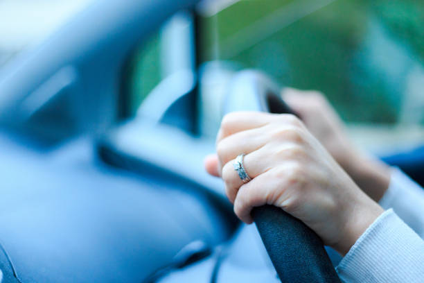 istock Close-up of a woman's hand holding a car handle 866897144