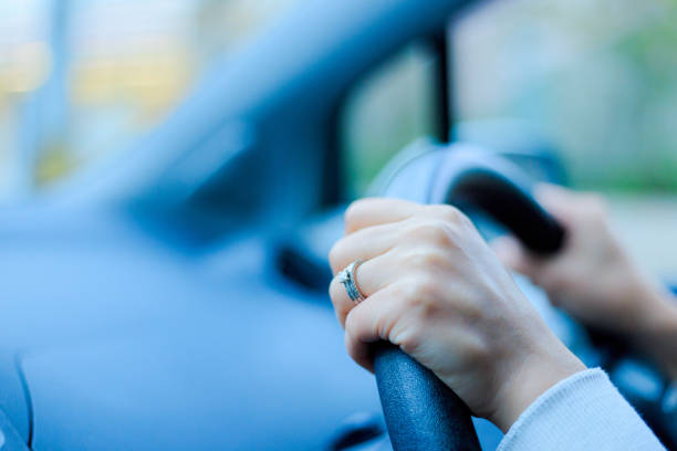 istock Close-up of a woman's hand holding a car handle 866897248