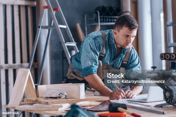 Handsome Carpenter Working In Workshop Stock Photo - Download Image Now - Small Business, Furniture, Owner