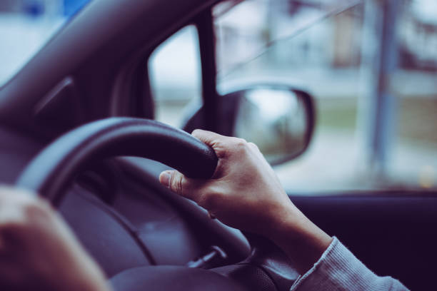 istock Close-up of a woman's hand holding a car handle 866898110