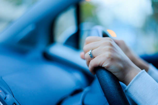 istock Close-up of a woman's hand holding a car handle 866898752
