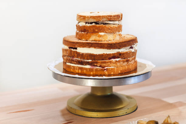 istock Naked cake, whip cream cake without topping on the table 866901060