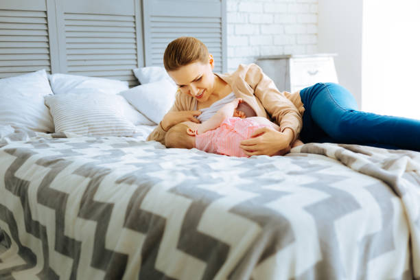 Positive mother getting ready for breastfeeding