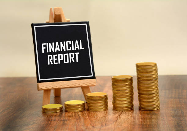 istock Financial Report sign with stack of Golden Coins 866904338