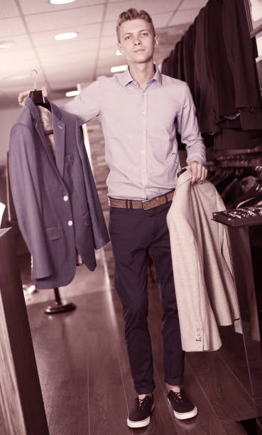 istock adult man buyer holding jackets 866908728