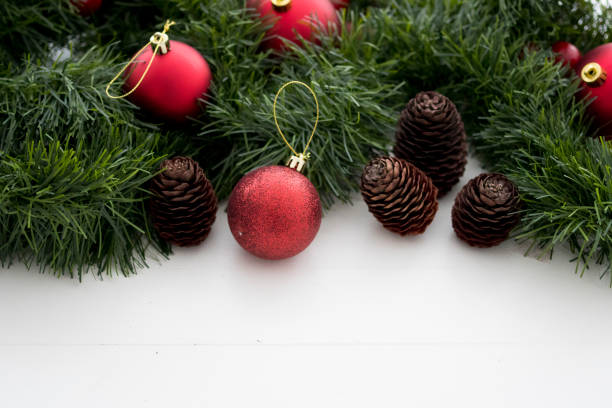istock Christmas ornaments, pine cones and ribbons 866909040