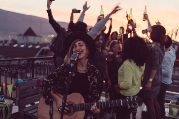 istock Guitar party on the rooftop 866910330