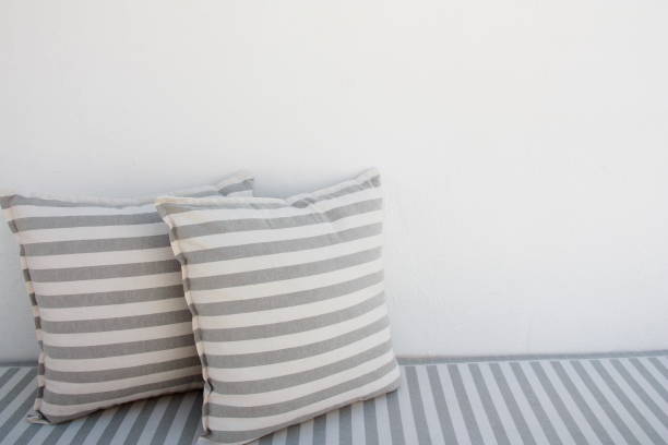 White and grey striped pillows outdoor stock photo