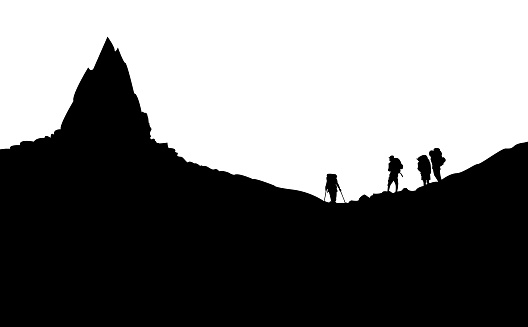 Silhouette of Mountaineers standing under the High Peak without background