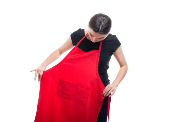 istock Young brunette seller putting red apron on 866922514