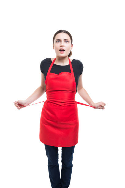 istock Young woman seller tying her apron 866922606