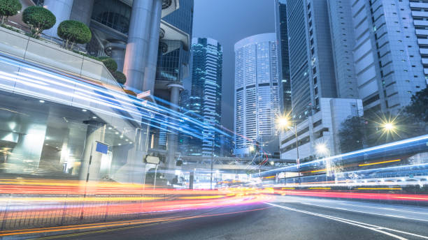 istock traffic trails in downtown Hong Kong 866922872