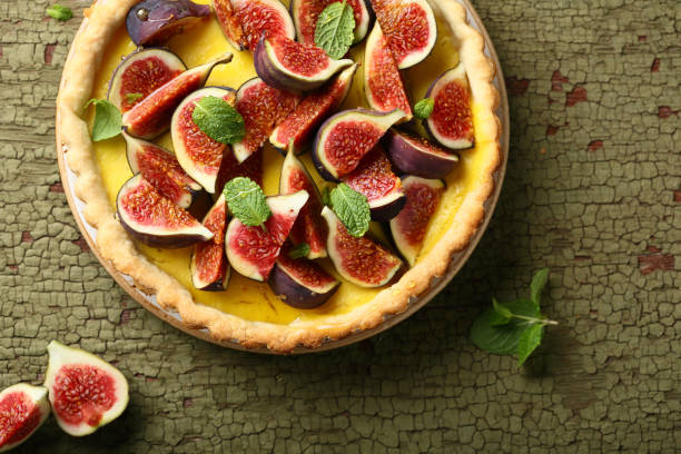 istock Tart with fresh figs and custard top view 866925382