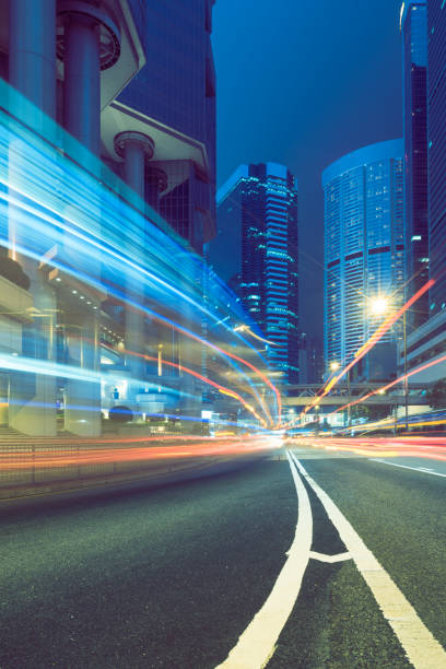 istock traffic trails in downtown hong kong 866925532