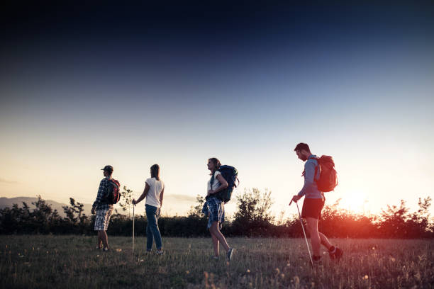 istock Walking in the sunglow hikers 866925726