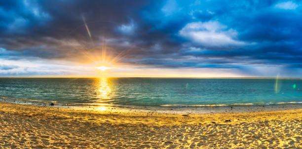 istock Flic en Flac beach at sunset. Panorama 866925928